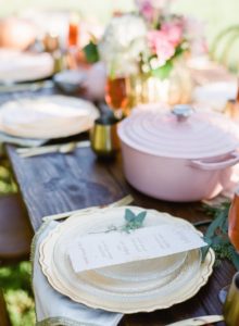 Pink Le Creuset Dutch oven on pink and gold tablescape