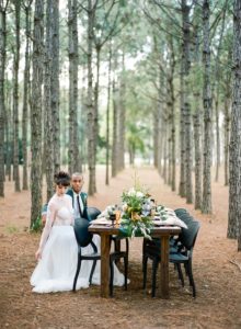 woodsy wedding tablescape in the trees