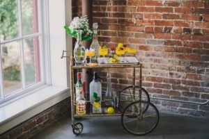 bright mod styled bar cart with cocktail