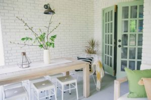 painted brick patio with painted doors