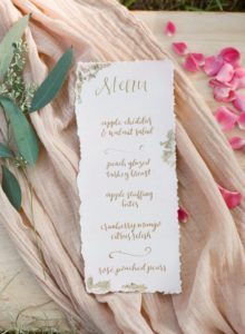 pink dyed calligraphy menu wiht deckled edges