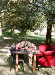 farm table with vintage upholstered sofa for seating