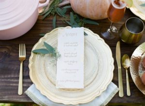gold and etched glass place setting