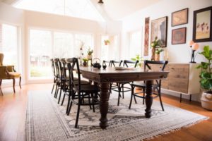 global eclectic dining room with antique farm table and modern chairs