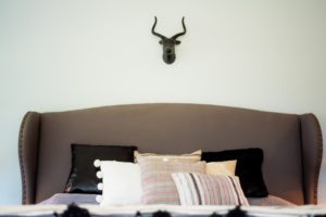 faux deer head over bed