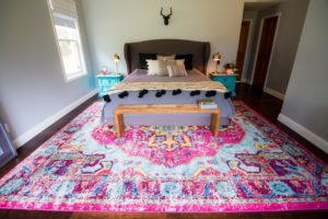 statement rug modern boho master bedroom with